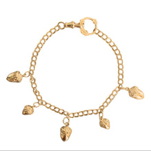 Gold bracelet with acorn charms on a white background