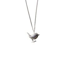 A silver bird pendant necklace on a delicate silver chain, shown against a plain white background.