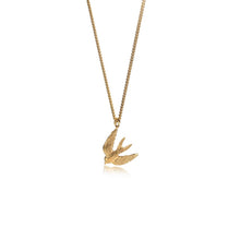 Gold necklace with a bird-shaped pendant on a white background
